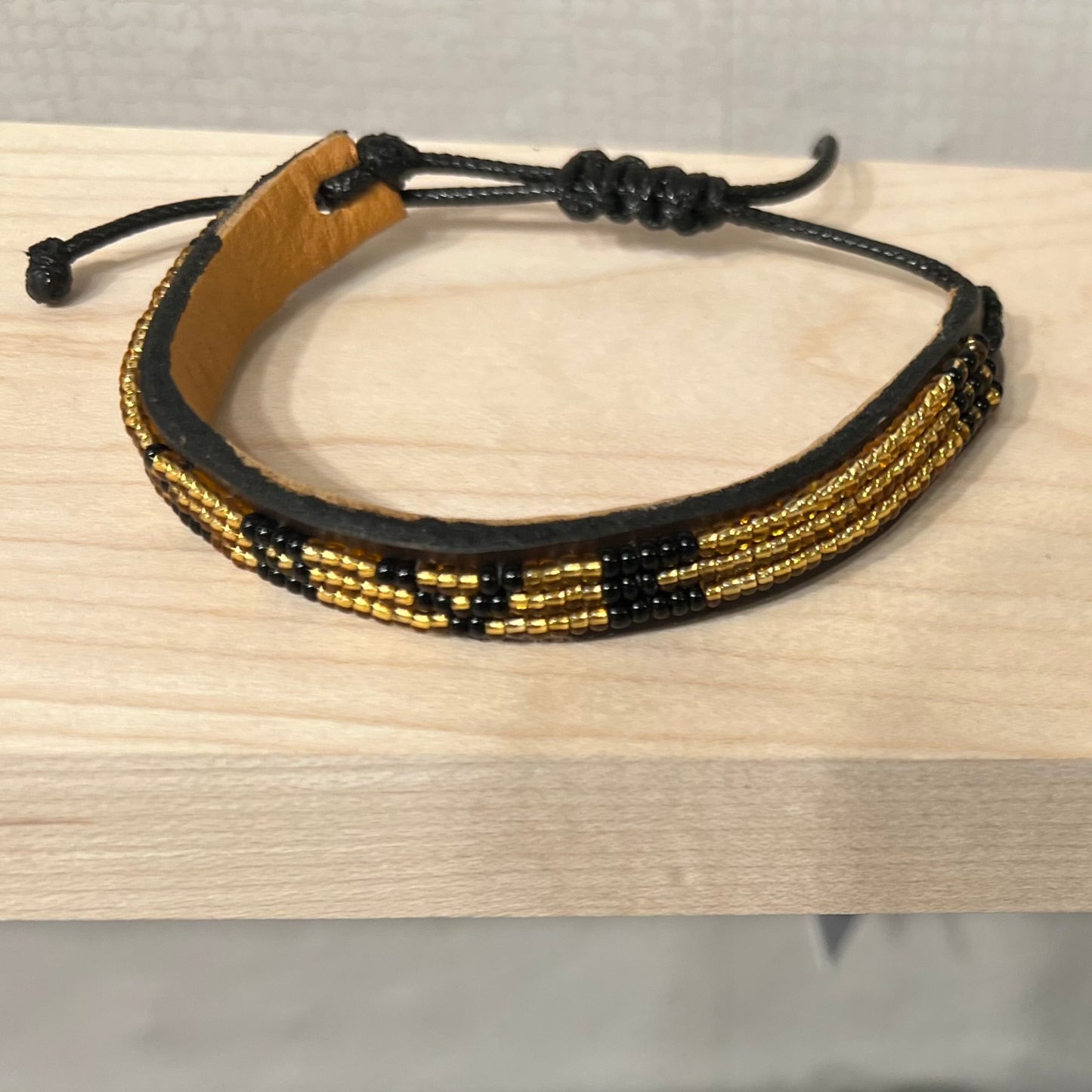 Love is project Gold Black LOVE Bracelet