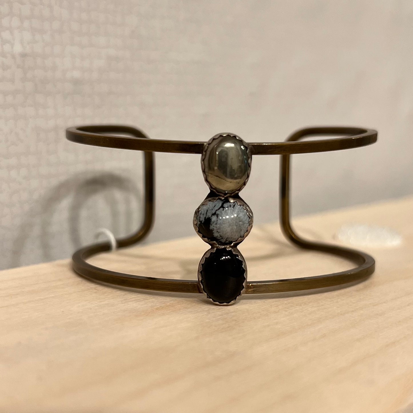 Stone Cooper Wide brass cuff with trio of stones