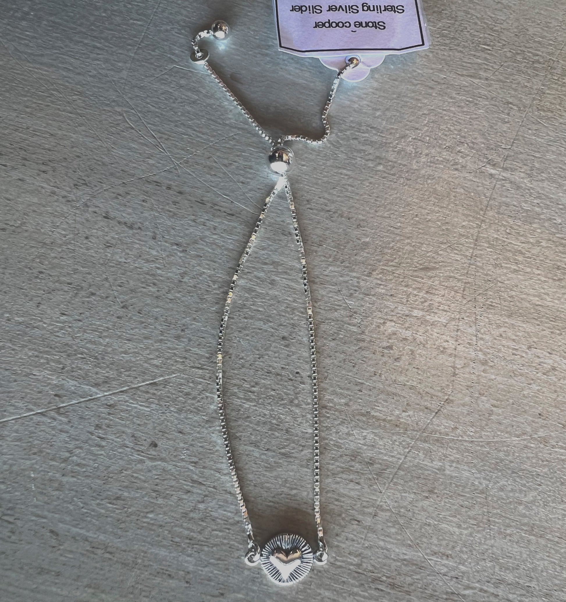 Slider bracelet with radiant heart charm